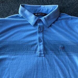 TravisMathew Coastal Chest Stripe Polo in the color Opal Blue Heather